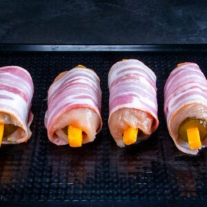 A new idea of appetizer – pickled cucumbers in chicken breast and bacon