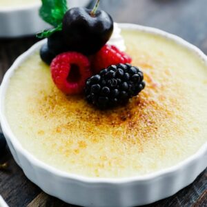 Rumchata Crème Brulee with Whipped Cream and Berries
